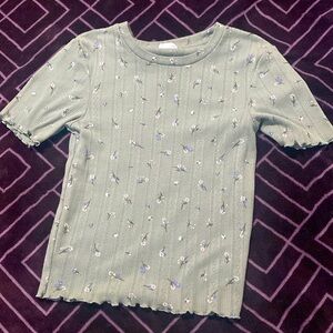 Sage green with little flower it looks tight but it’s stretchy it’s a size XS